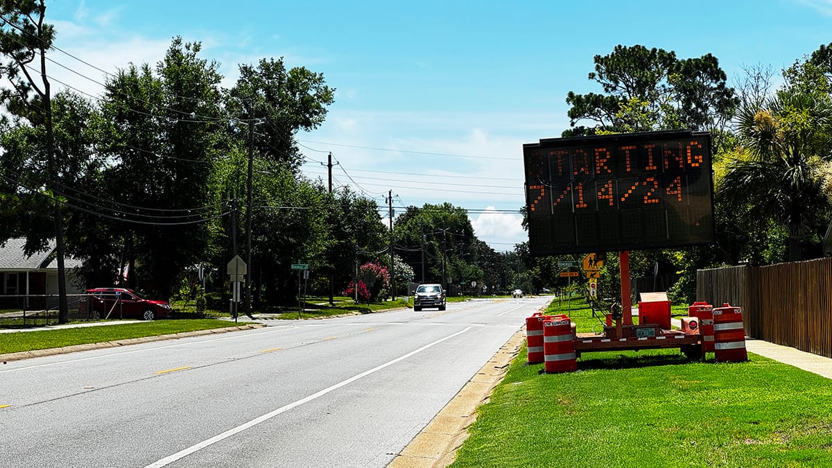 A traffic sign warning of a road closure.