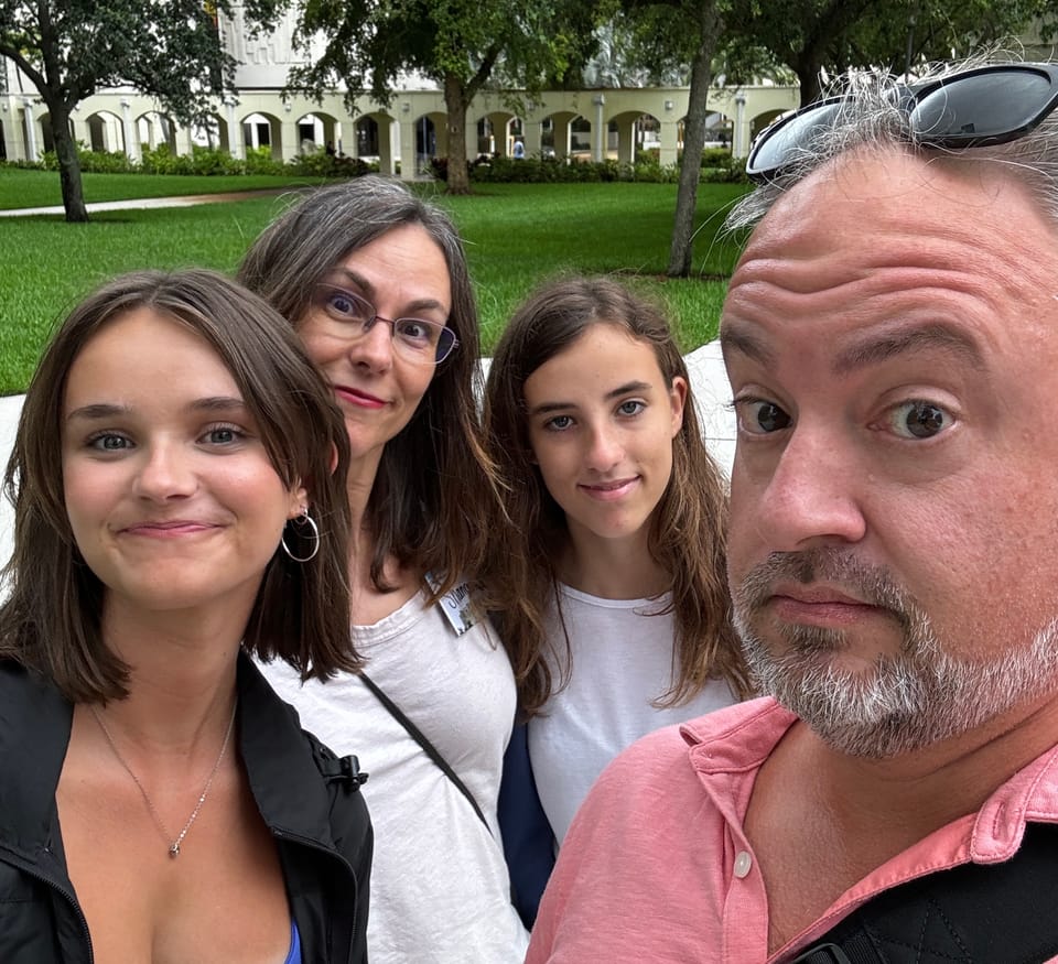 Mia, Shannon, Isabella and Phil Nickinson pose for the camera at Florida International University in Miami.