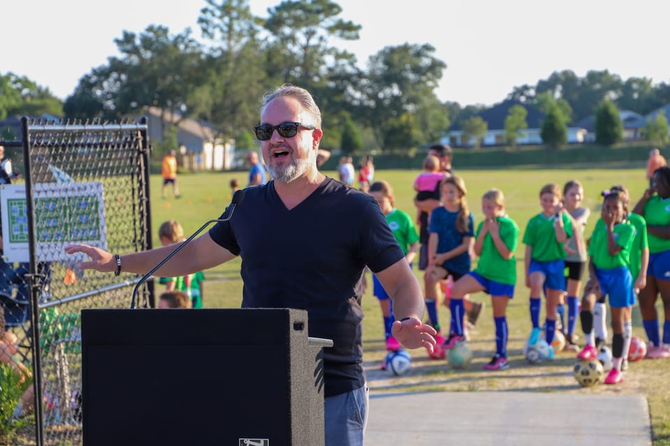 Phil Nickinson speaking at the Hizman Park ribbon-cutting in September 2022.